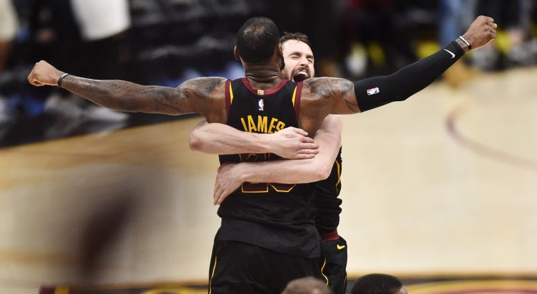 Kevin Love hugs LeBron James after Game 3 buzzer beater vs. Raptors. Kevin Love hugs LeBron James